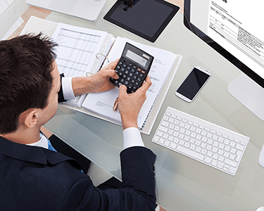 Man Using Calculator